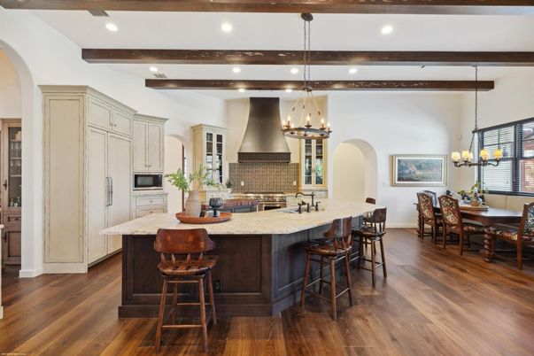 Chandelier, Dining room, Interior, Kitchen, Pendant Lights, Recessed Lighting, Stainless Steel Appliances, Wooden Beams, Wood Texture Flooring