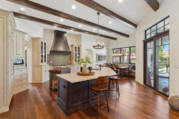 Chandelier, Dining room, Interior, Kitchen, Pendant Lights, Recessed Lighting, Stainless Steel Appliances, Wooden Beams, Wood Texture Flooring