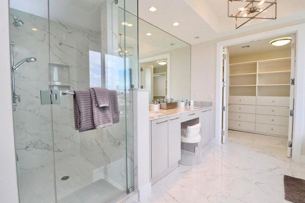 Bathroom, Dual Sink Vanities, Glass Shower, Interior, Marble, Marble Walls, Recessed Lighting, Walk-in Closets