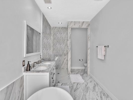 Bathroom, Dual Sink Vanities, Interior, Marble, Marble Walls, Recessed Lighting