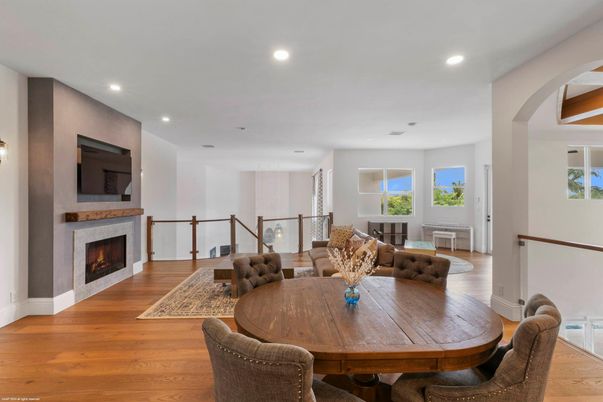Dining room, Fireplace, Interior, Living room, Recessed Lighting, Wood Texture Flooring