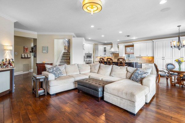 Chandelier, Dining room, Interior, Kitchen, Living room, Pendant Lights, Recessed Lighting, Stainless Steel Appliances, Wood Texture Flooring