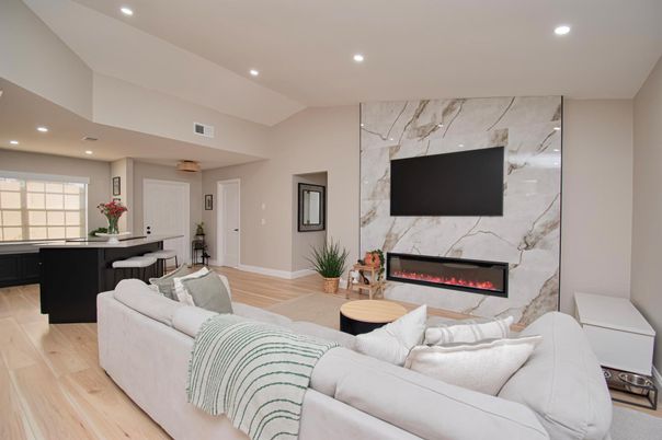 Fireplace, Interior, Living room, Marble Walls, Recessed Lighting, Wood Texture Flooring