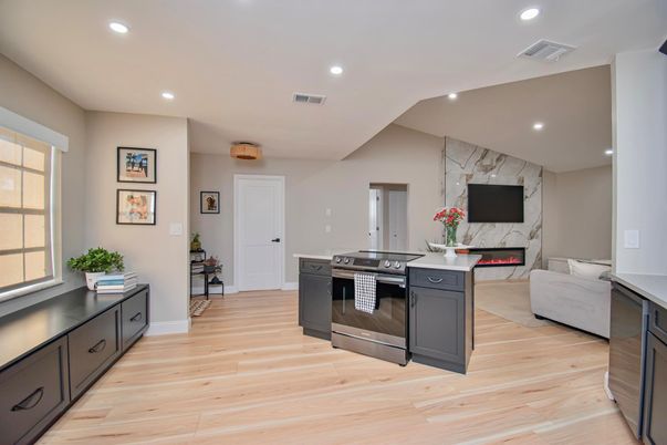 Fireplace, Interior, Kitchen, Living room, Marble Walls, Recessed Lighting, Stainless Steel Appliances, Wood Texture Flooring