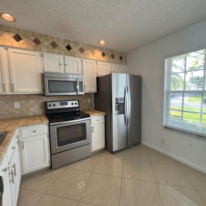Interior, Kitchen, Recessed Lighting, Stainless Steel Appliances, Tile Countertops