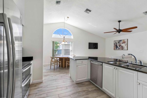 Dining room, Interior, Kitchen, Pendant Lights, Stainless Steel Appliances, Wood Texture Flooring