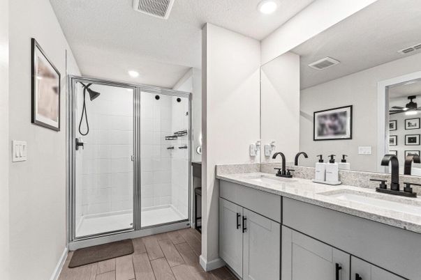Bathroom, Dual Sink Vanities, Glass Shower, Interior, Recessed Lighting, Wood Texture Flooring