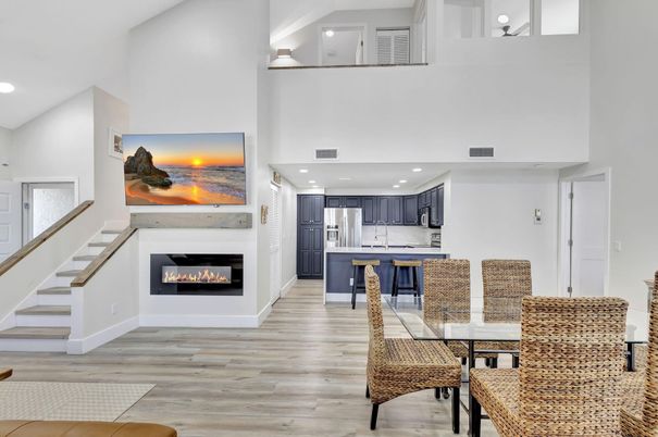 Dining room, Fireplace, Interior, Kitchen, Recessed Lighting, Stainless Steel Appliances, Wood Texture Flooring