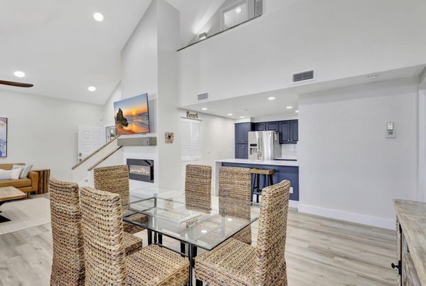 Dining room, Fireplace, Interior, Kitchen, Living room, Recessed Lighting, Stainless Steel Appliances, Wood Texture Flooring