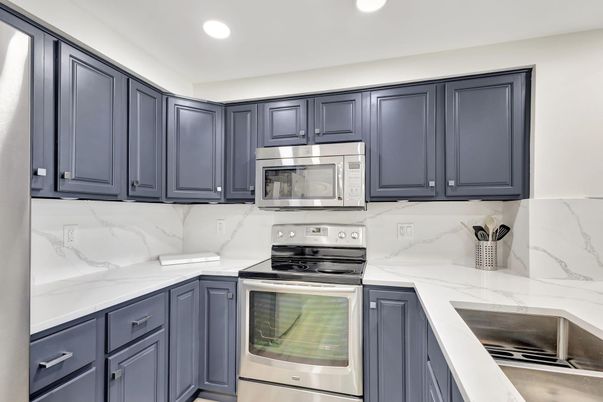 Interior, Kitchen, Marble Walls, Recessed Lighting, Stainless Steel Appliances