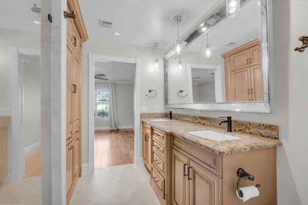 Bathroom, Dual Sink Vanities, Interior, Pendant Lights, Recessed Lighting, Wood Texture Flooring