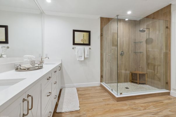 Bathroom, Dual Sink Vanities, Glass Shower, Interior, Recessed Lighting, Wood Texture Flooring