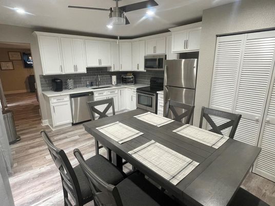 Dining room, Interior, Kitchen, Recessed Lighting, Stainless Steel Appliances, Wood Texture Flooring