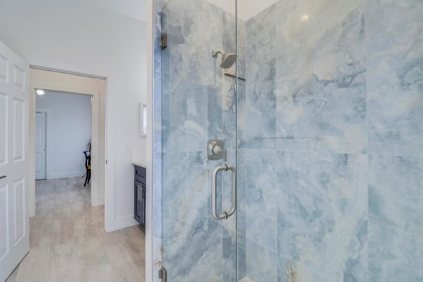 Bathroom, Glass Shower, Interior, Marble Walls, Recessed Lighting, Wood Texture Flooring