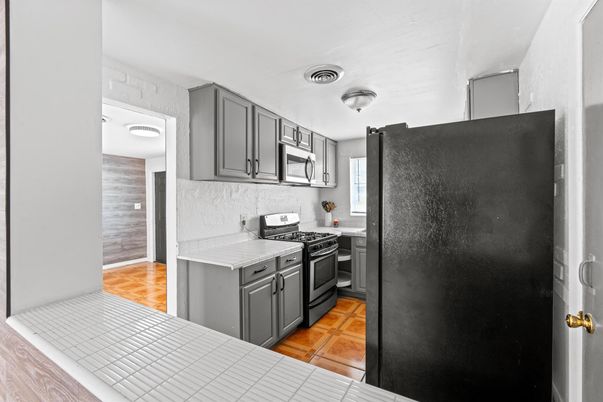 Interior, Kitchen, Tile Countertops, Wood Texture Flooring