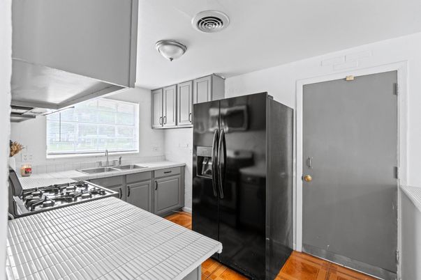 Interior, Kitchen, Tile Countertops, Wood Texture Flooring