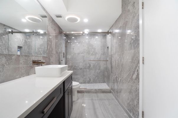 Bathroom, Glass Shower, Interior, Marble Walls, Recessed Lighting, Wood Texture Flooring
