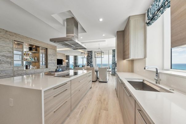 Dining room, Interior, Kitchen, Pendant Lights, Recessed Lighting, Stainless Steel Appliances, Stone Walls, Water, Wood Texture Flooring