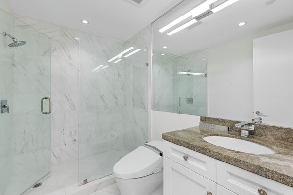 Bathroom, Dual Sink Vanities, Glass Shower, Interior, Marble, Marble Walls, Recessed Lighting