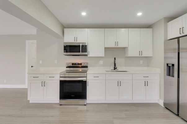 Interior, Kitchen, Recessed Lighting, Stainless Steel Appliances, Wood Texture Flooring