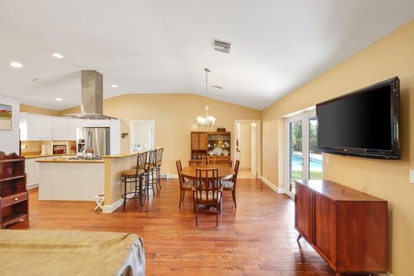 Chandelier, Dining room, Interior, Kitchen, Recessed Lighting, Stainless Steel Appliances, Wood Texture Flooring