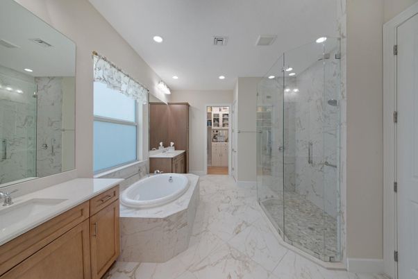 Bathroom, Dual Sink Vanities, Glass Shower, Interior, Marble, Marble Walls, Recessed Lighting