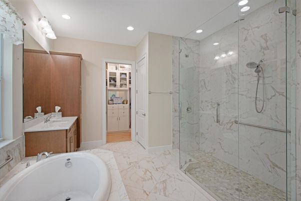 Bathroom, Dual Sink Vanities, Glass Shower, Interior, Marble, Marble Walls, Recessed Lighting