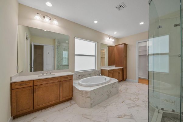 Bathroom, Dual Sink Vanities, Glass Shower, Interior, Marble, Marble Walls, Recessed Lighting