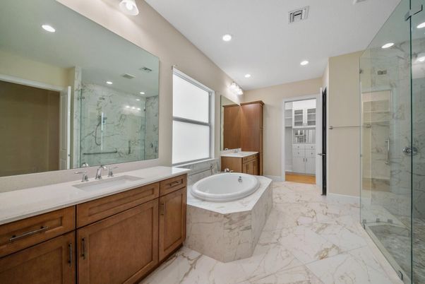 Bathroom, Dual Sink Vanities, Glass Shower, Interior, Marble, Marble Walls, Recessed Lighting