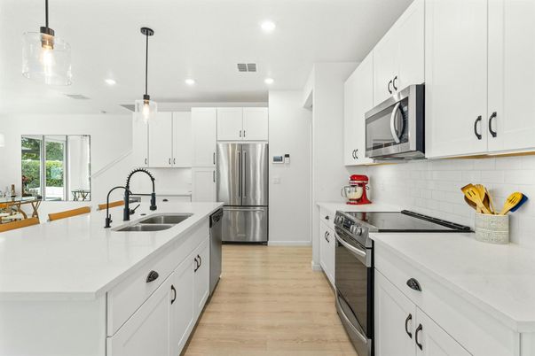Interior, Kitchen, Pendant Lights, Recessed Lighting, Stainless Steel Appliances, Wood Texture Flooring