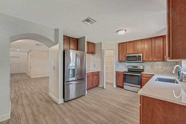 Interior, Kitchen, Recessed Lighting, Stainless Steel Appliances, Wood Texture Flooring