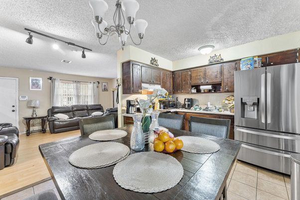 Chandelier, Dining room, Interior, Kitchen, Living room, Stainless Steel Appliances, Wood Texture Flooring