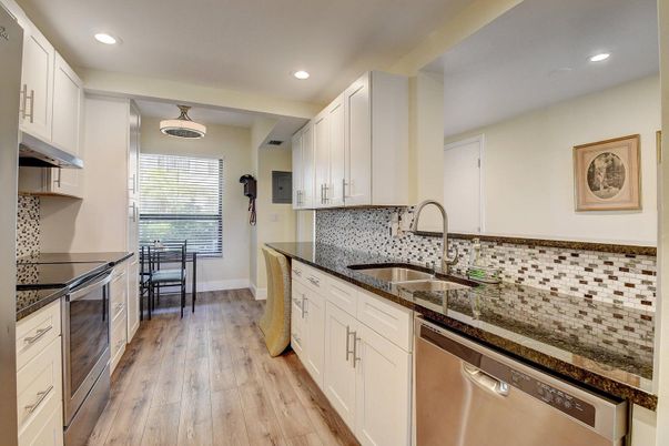 Dining room, Interior, Kitchen, Recessed Lighting, Stainless Steel Appliances, Wood Texture Flooring
