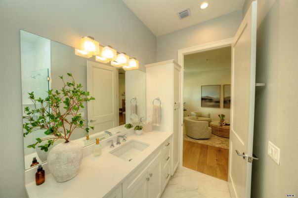Bathroom, Dual Sink Vanities, Interior, Marble, Recessed Lighting, Wood Texture Flooring