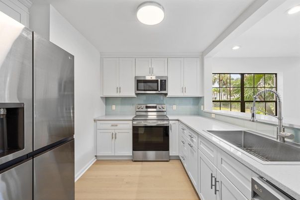 Interior, Kitchen, Recessed Lighting, Stainless Steel Appliances, Wood Texture Flooring