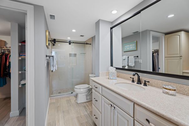 Bathroom, Dual Sink Vanities, Glass Shower, Interior, Recessed Lighting, Wood Texture Flooring