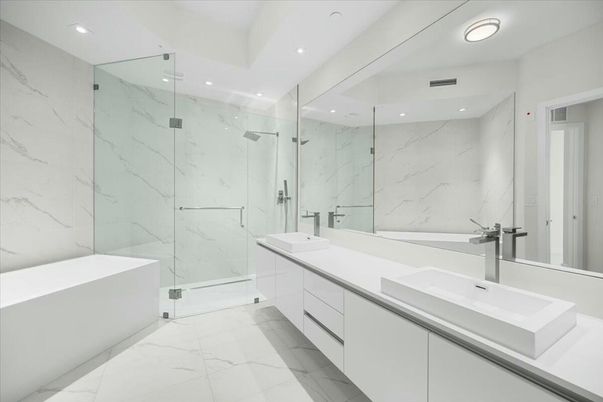 Bathroom, Dual Sink Vanities, Glass Shower, Interior, Marble, Marble Walls, Recessed Lighting