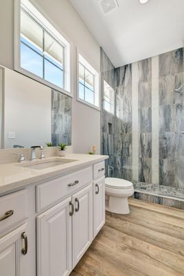 Bathroom, Glass Shower, Interior, Marble Walls, Recessed Lighting, Wood Texture Flooring