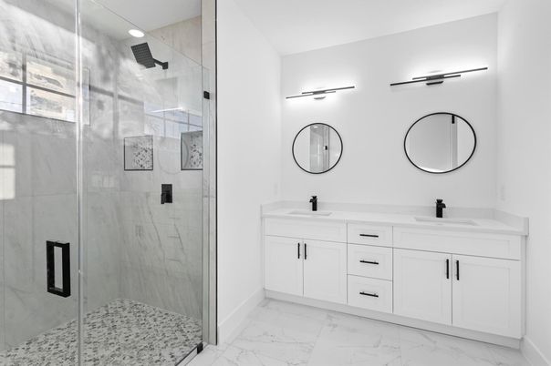 Bathroom, Dual Sink Vanities, Glass Shower, Interior, Marble, Marble Walls, Recessed Lighting