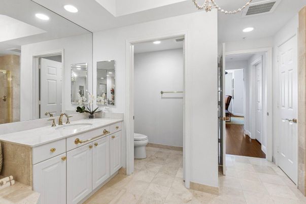 Bathroom, Dual Sink Vanities, Glass Shower, Interior, Recessed Lighting, Wood Texture Flooring
