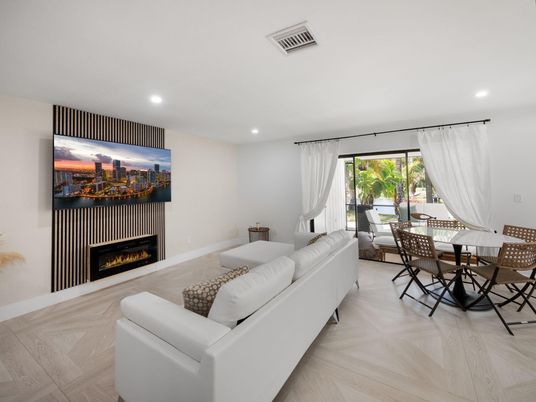 Dining room, Fireplace, Interior, Living room, Recessed Lighting, Wood Texture Flooring