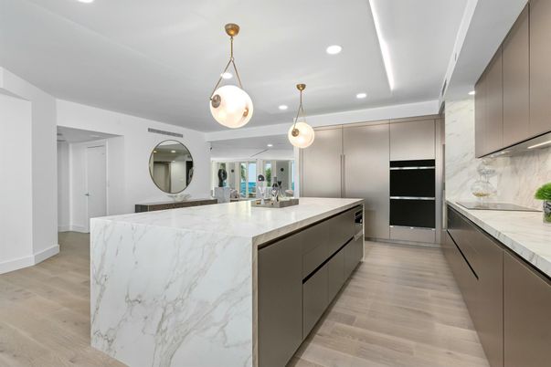 Interior, Kitchen, Marble Walls, Pendant Lights, Recessed Lighting, Stainless Steel Appliances, Wood Texture Flooring