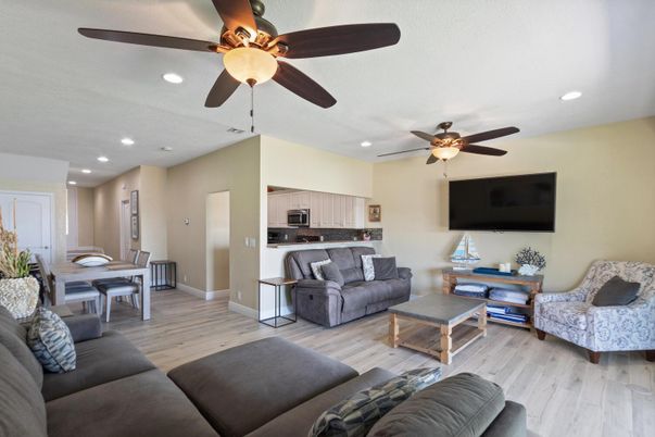 Dining room, Interior, Kitchen, Living room, Recessed Lighting, Stainless Steel Appliances, Wood Texture Flooring