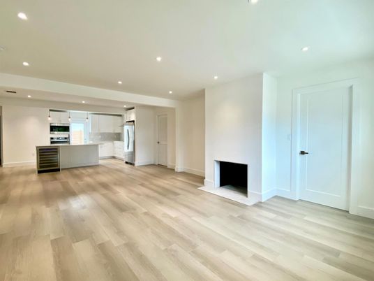 Empty room, Interior, Kitchen, Recessed Lighting, Stainless Steel Appliances, Wood Texture Flooring