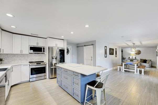 Dining room, Interior, Kitchen, Pendant Lights, Recessed Lighting, Stainless Steel Appliances, Wood Texture Flooring