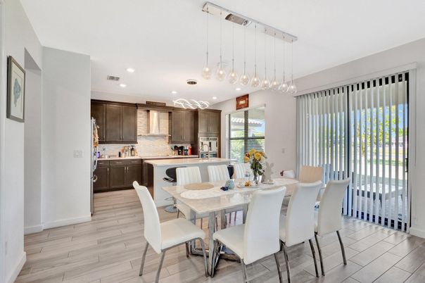 Dining room, Interior, Kitchen, Pendant Lights, Recessed Lighting, Stainless Steel Appliances, Wood Texture Flooring