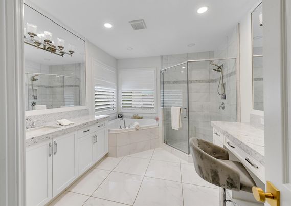 Bathroom, Dual Sink Vanities, Glass Shower, Interior, Marble, Marble Walls, Recessed Lighting