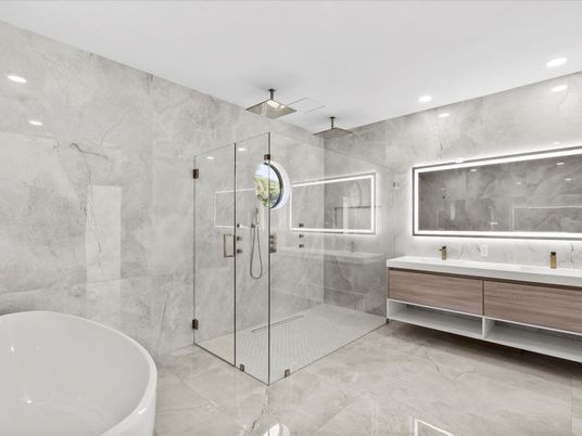 Bathroom, Dual Sink Vanities, Free Standing Baths, Glass Shower, Interior, Marble Walls, Recessed Lighting