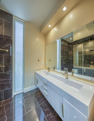 Bathroom, Dual Sink Vanities, Glass Shower, Interior, Marble, Marble Walls, Recessed Lighting