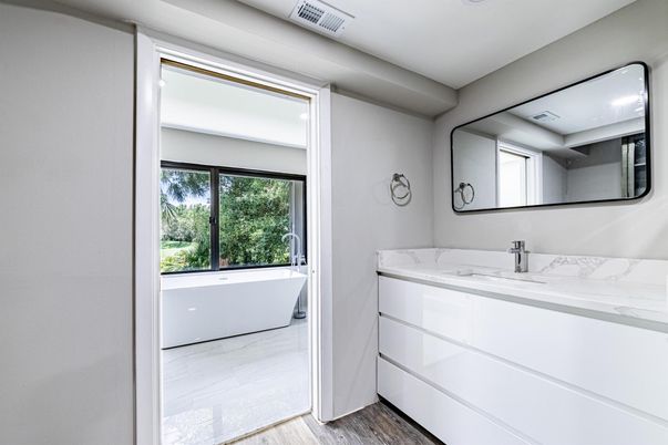 Bathroom, Dual Sink Vanities, Free Standing Baths, Interior, Marble, Recessed Lighting, Wood Texture Flooring